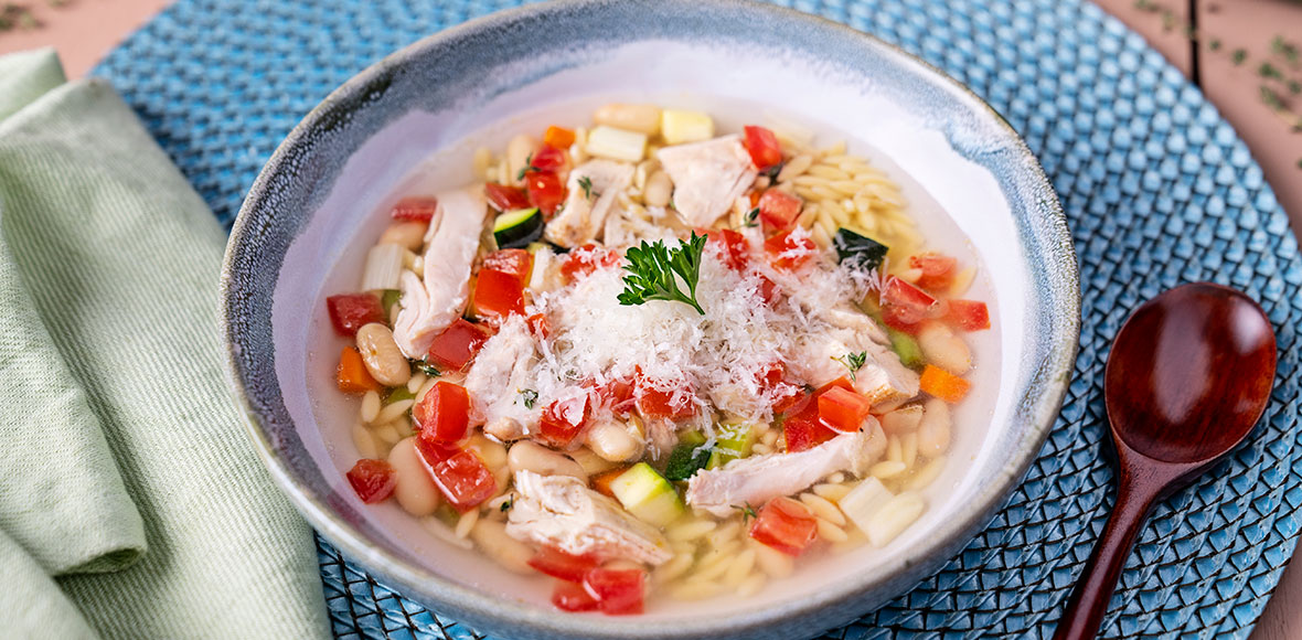 Parmesan Infused Summer Minestrone Soup With Shredded Chicken And Orzo